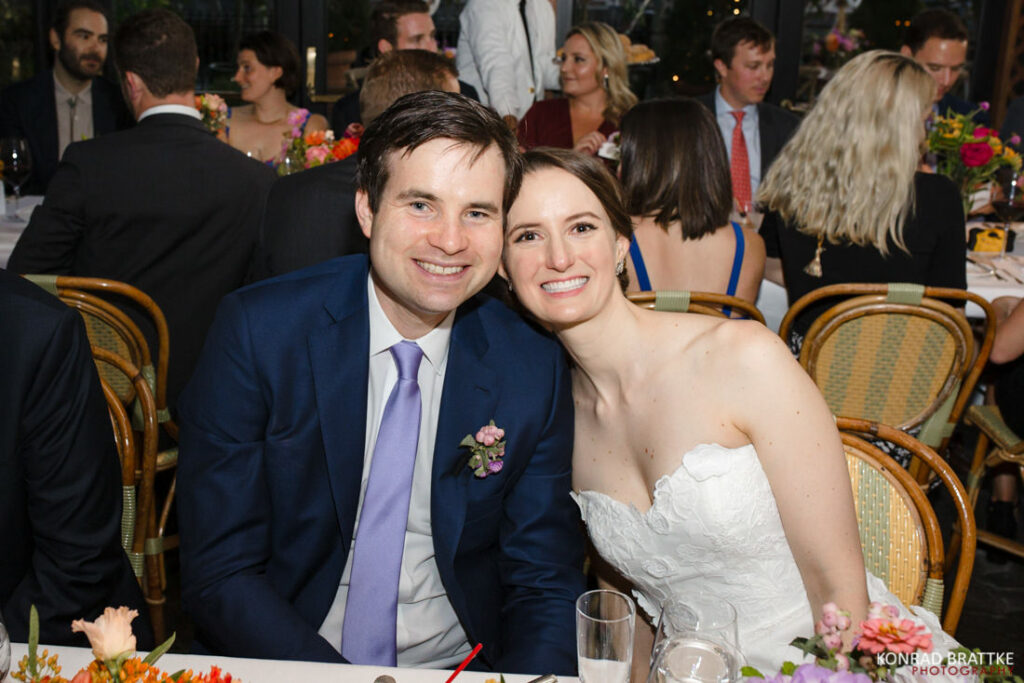 A bride and groom posing for a photo at the River Cafe.