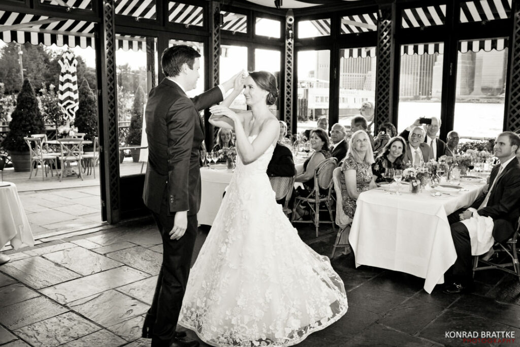 A bride and groom sharing their first dance at a wedding at the river cafe.