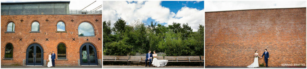 A bride and groom pose in front of a charming brick building.