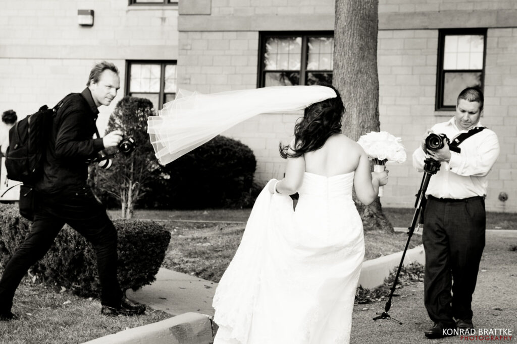 A Maryland wedding photographer captures a stunning image of a bride with her veil gracefully blowing in the wind.