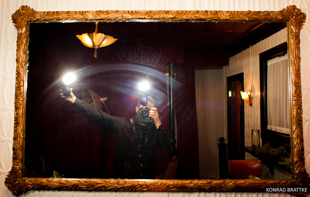 A Maryland wedding photographers self portrait captured through a mirror.