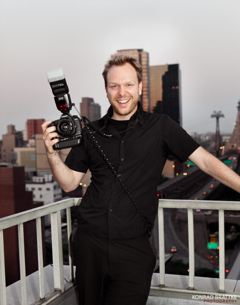 Konrad Brattke, a Maryland wedding photographer, capturing moments with his camera.