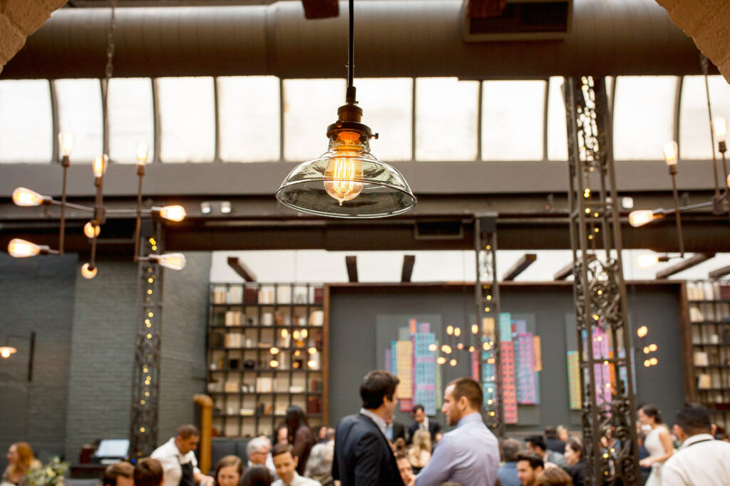 A group of people sitting at a table in spacious New York restaurant The Milling Room.