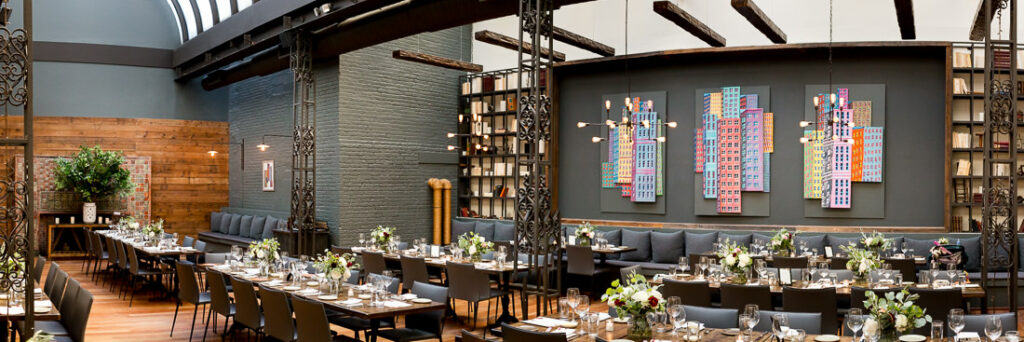 A dining room with tables and chairs set up in The Milling Room.