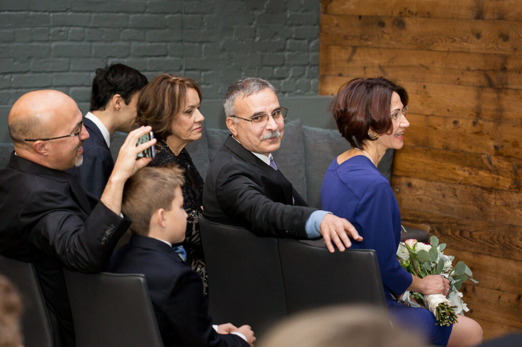 A group of people sitting in a room.