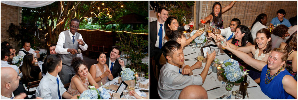 A group of people toasting at Bacchus Bistro during a wedding reception.
