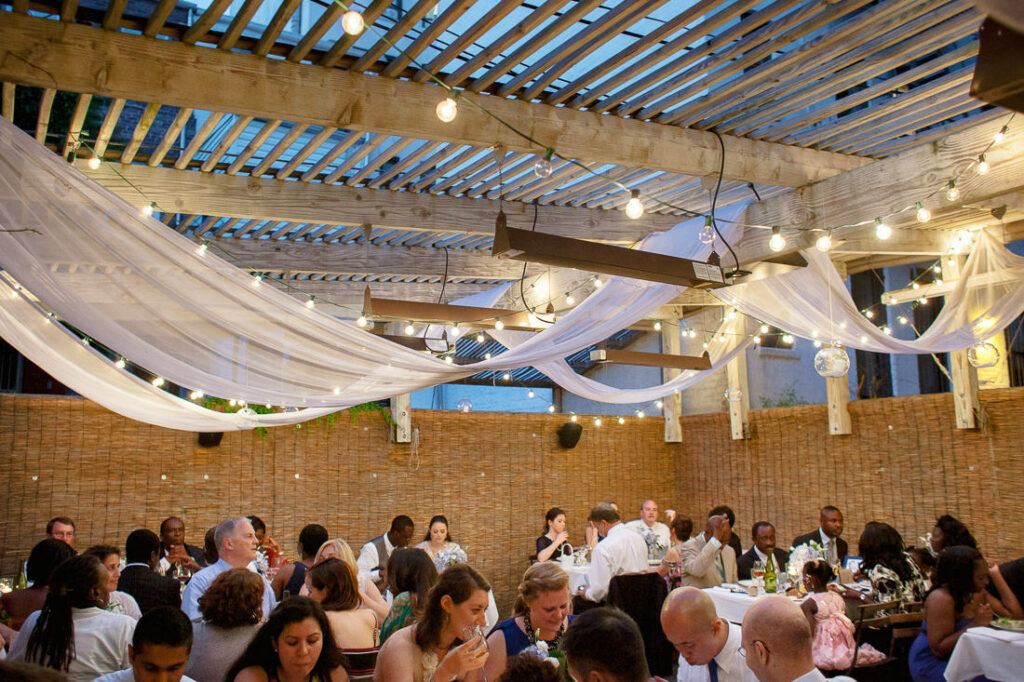 A wedding reception at Bacchus Bistro with people sitting at tables.