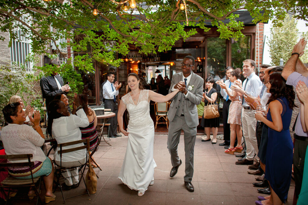 A bride and groom entering Bacchus Bistro.