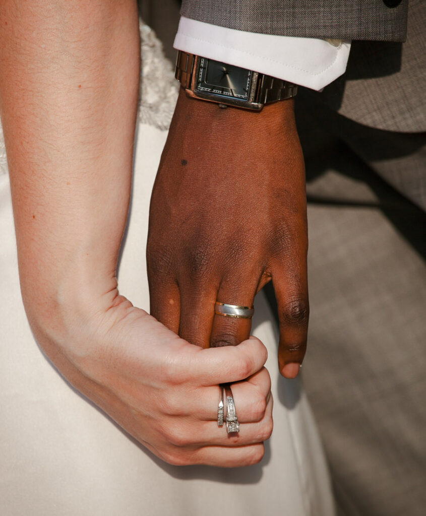 A couple holding hands at Bacchus Bistro.