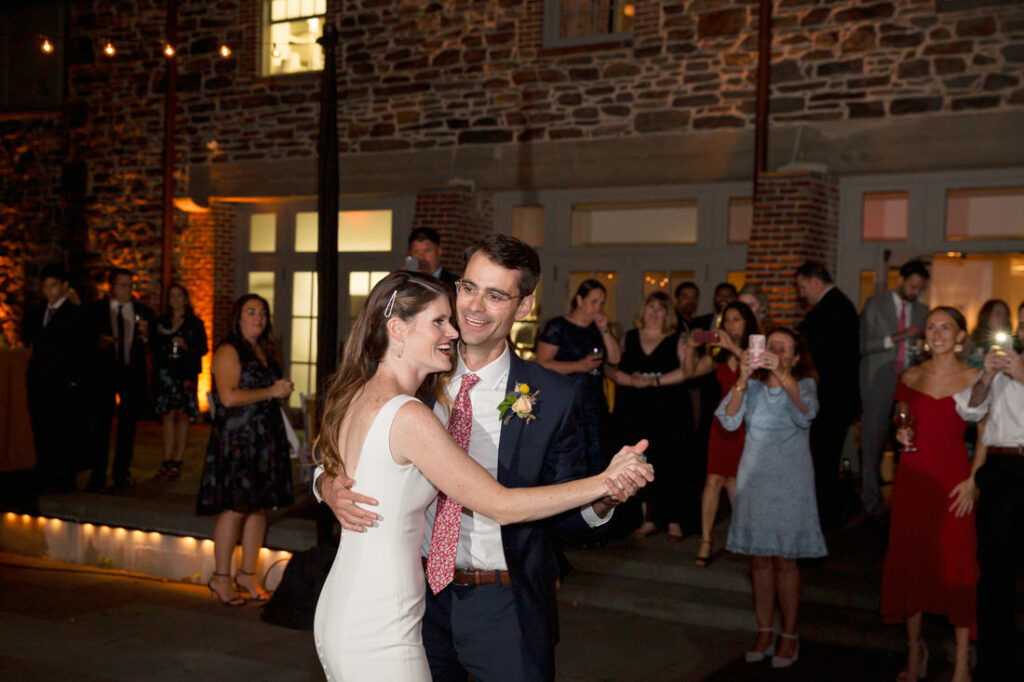 A bride and groom sharing their first dance at the New York Botanical Garden wedding reception.