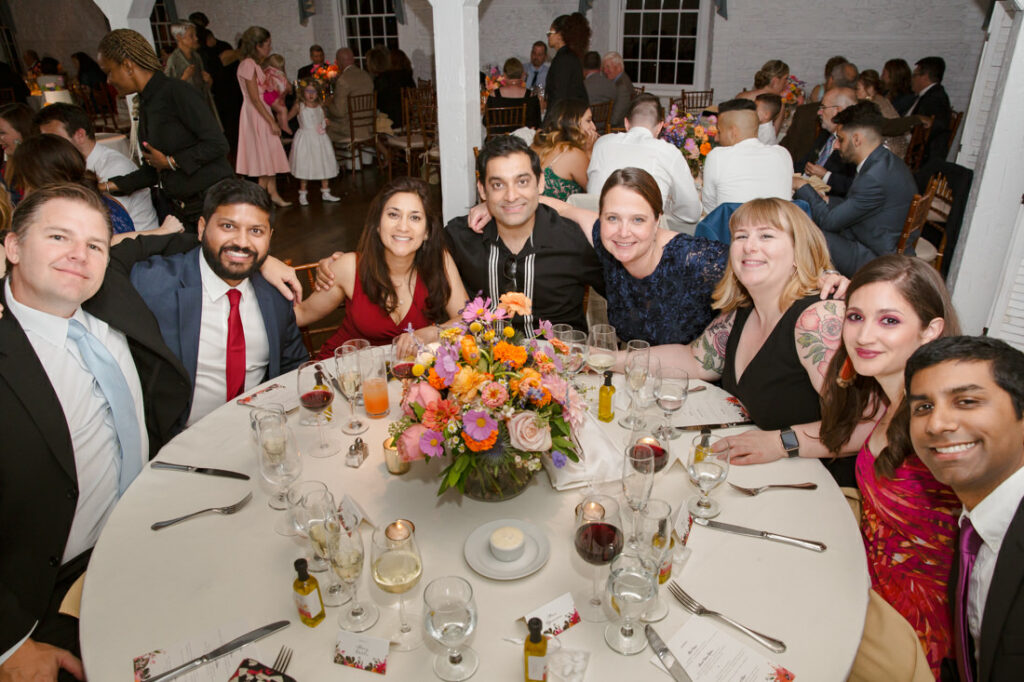 A group of people posing for a photo at the New York Botanical Garden.