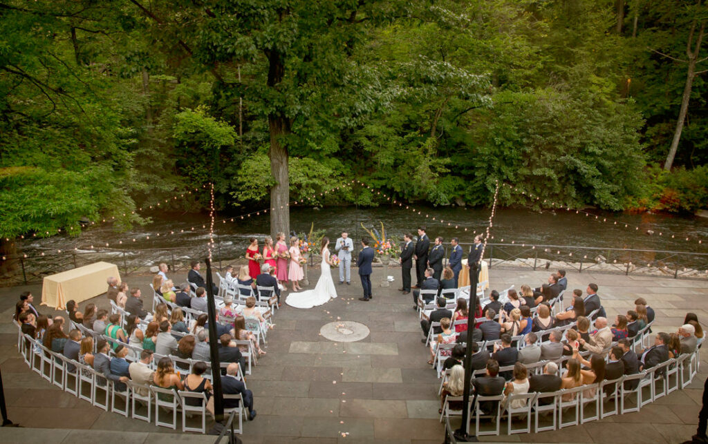 A riverside wedding ceremony at the New York Botanical Garden, a stunning venue nestled amidst lush greenery and vibrant botanical displays.