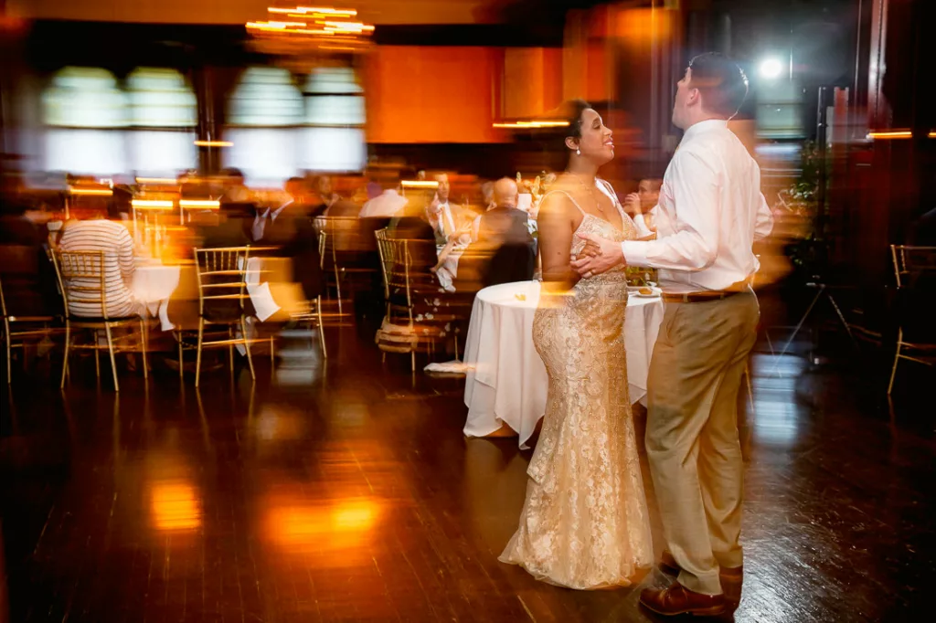 A bride and groom dancing at a wedding reception at the Montauk Club.