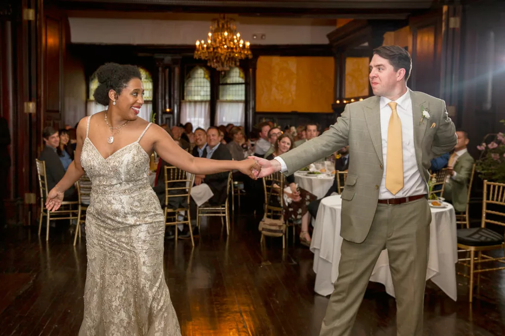 A bride and groom dancing at a wedding reception at the Montauk Club.