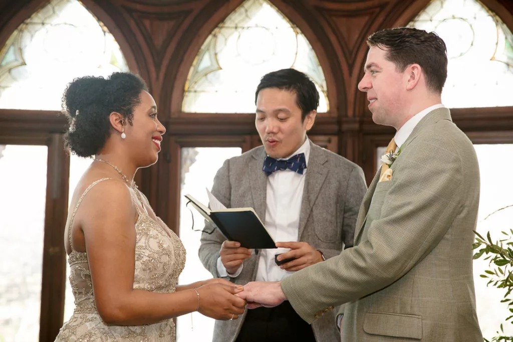A bride and groom exchange vows at the Montauk Club.