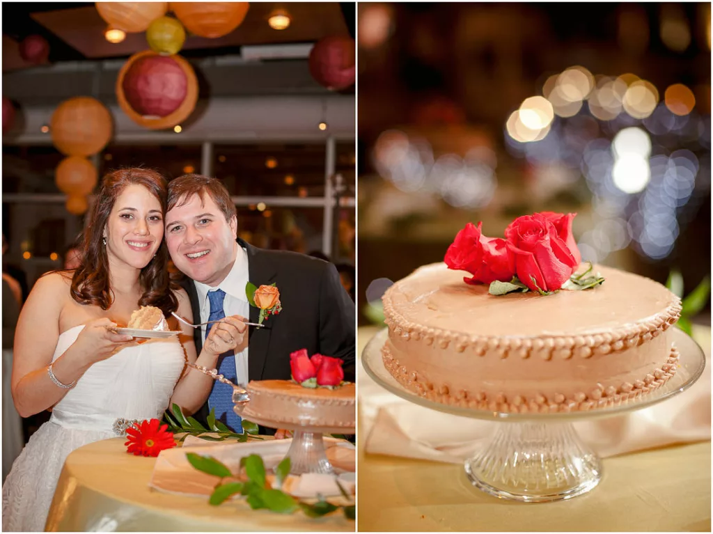 A bride and groom with a cake in front of them.