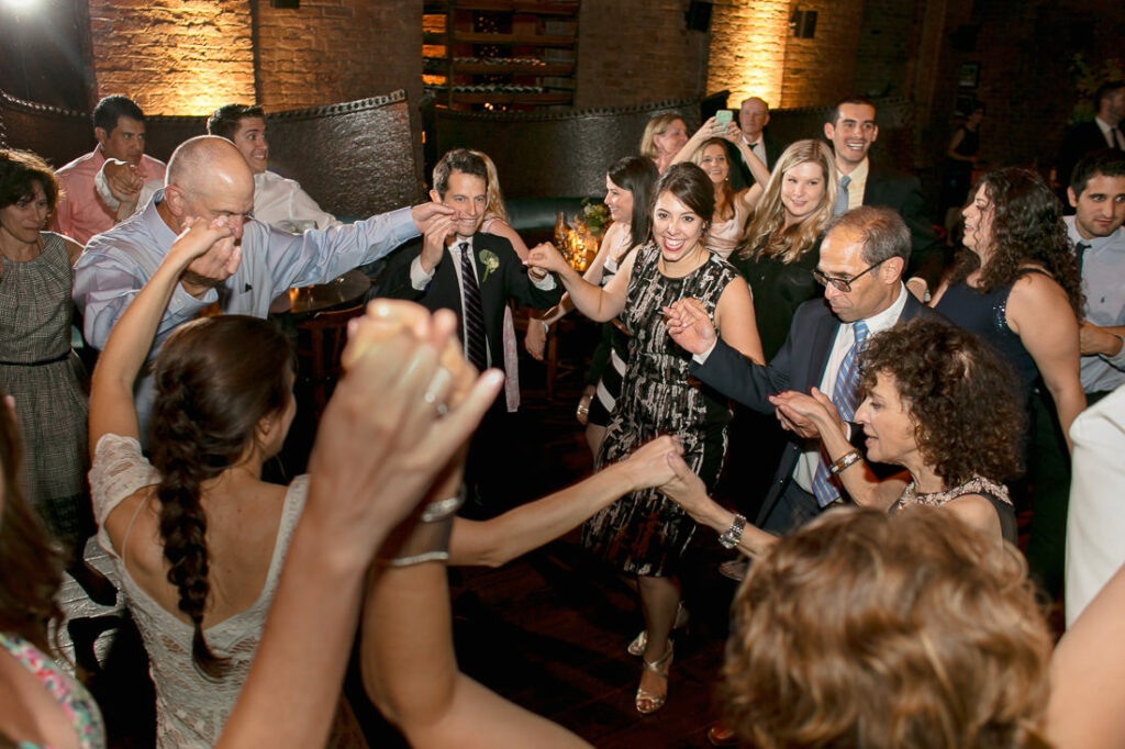 A group of people dancing at a wedding in Williamsburg.