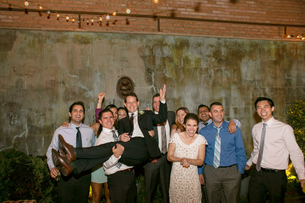 A group of people posing for a photo on a mymoon.