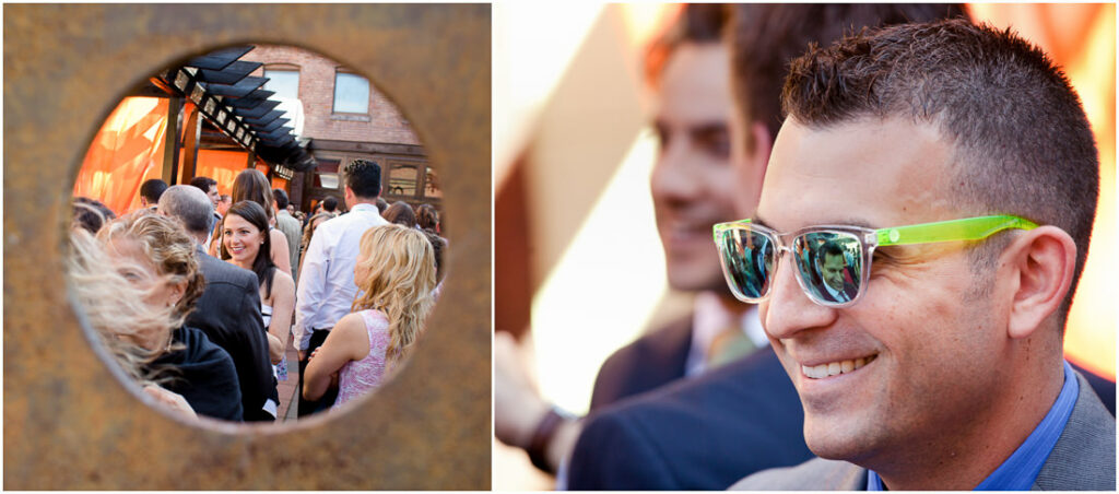 A man wearing sunglasses confidently addresses a group of people, his mysterious demeanor enhanced by the subtle tint of his shades.