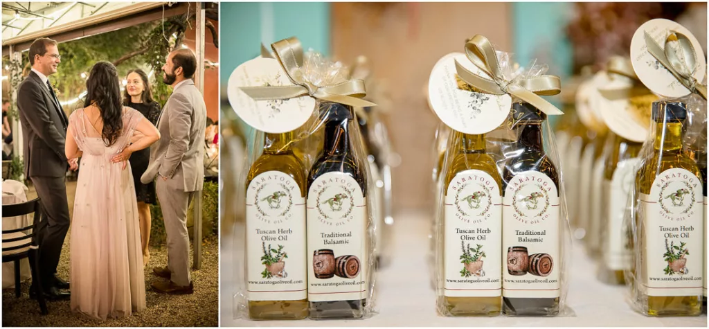 A bride and groom are standing next to bottles of olive oil.