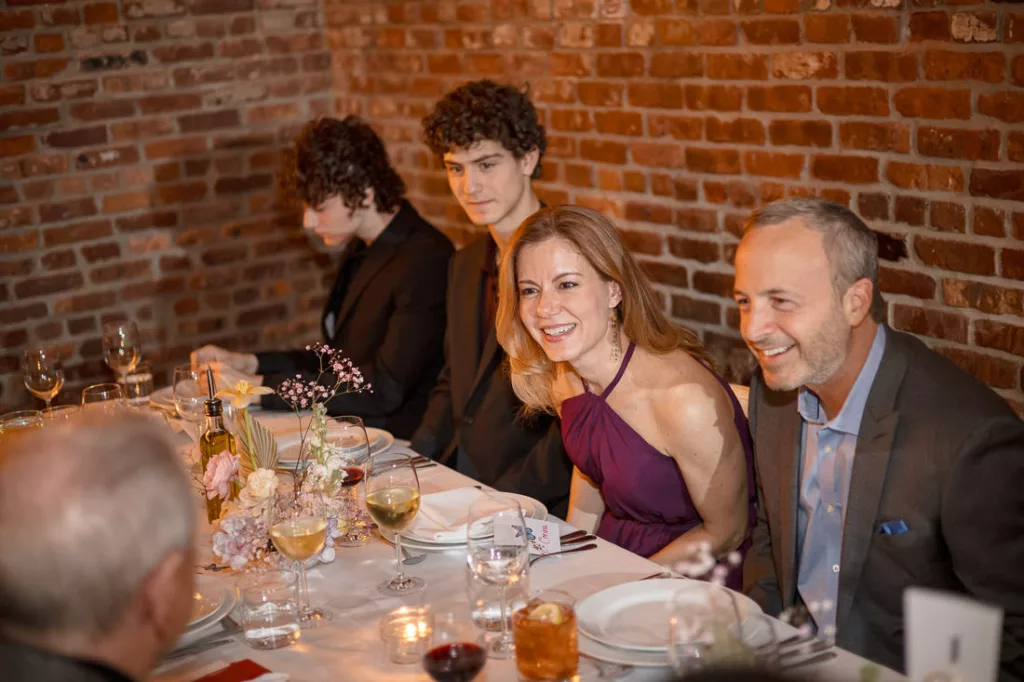 A group of people sitting around a table at Frankies 457 Spuntino.