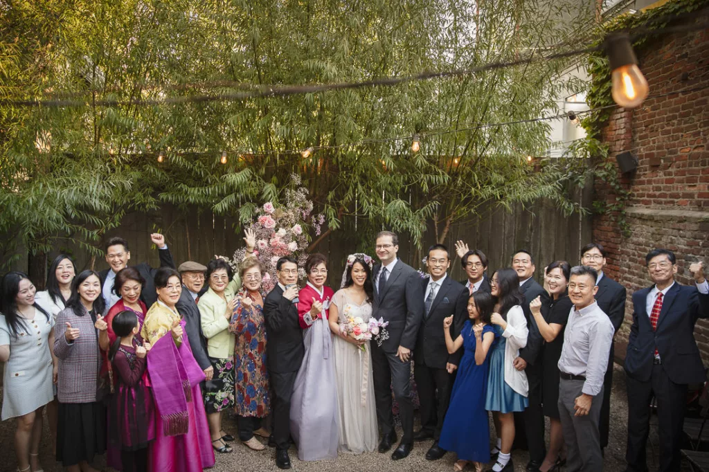 Asian wedding party posing for a photo.