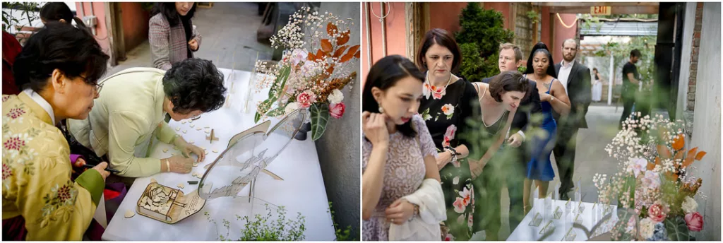 A group of people are putting flowers on a table.