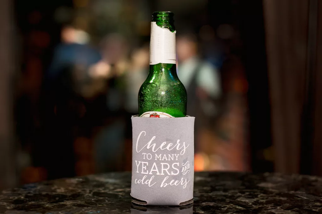 A bottle of wine is sitting on a table.