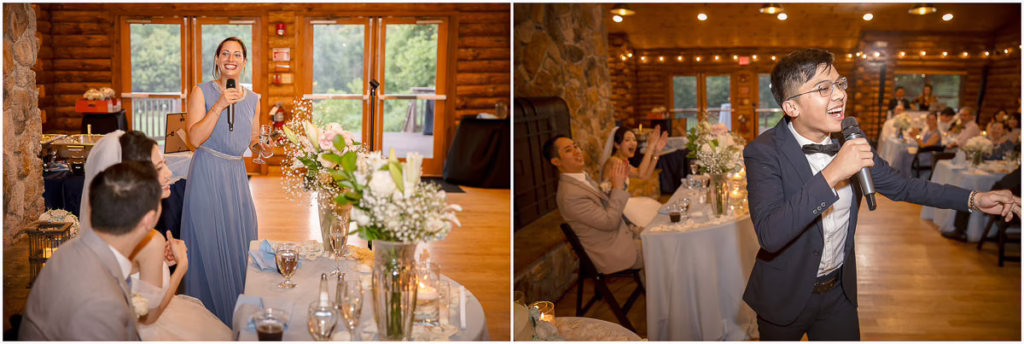 Two people give speeches with microphones at a wedding reception in a rustic venue with wooden walls, while guests seated at tables listen and applaud.